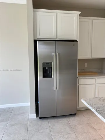 a kitchen with appliances and cabinets