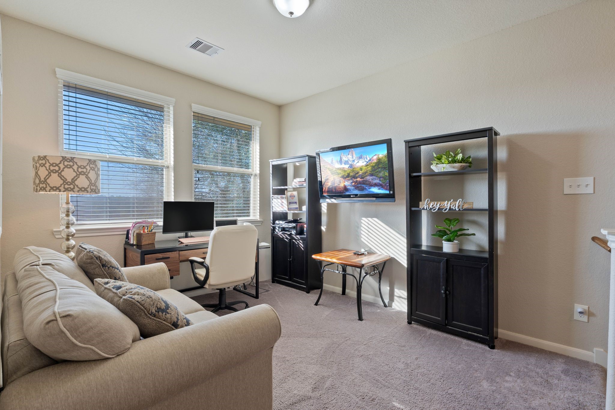 227 Biltmore Loop Montgomery, TX 77316 - Photo 11 of 25 a living room with furniture and a flat screen tv