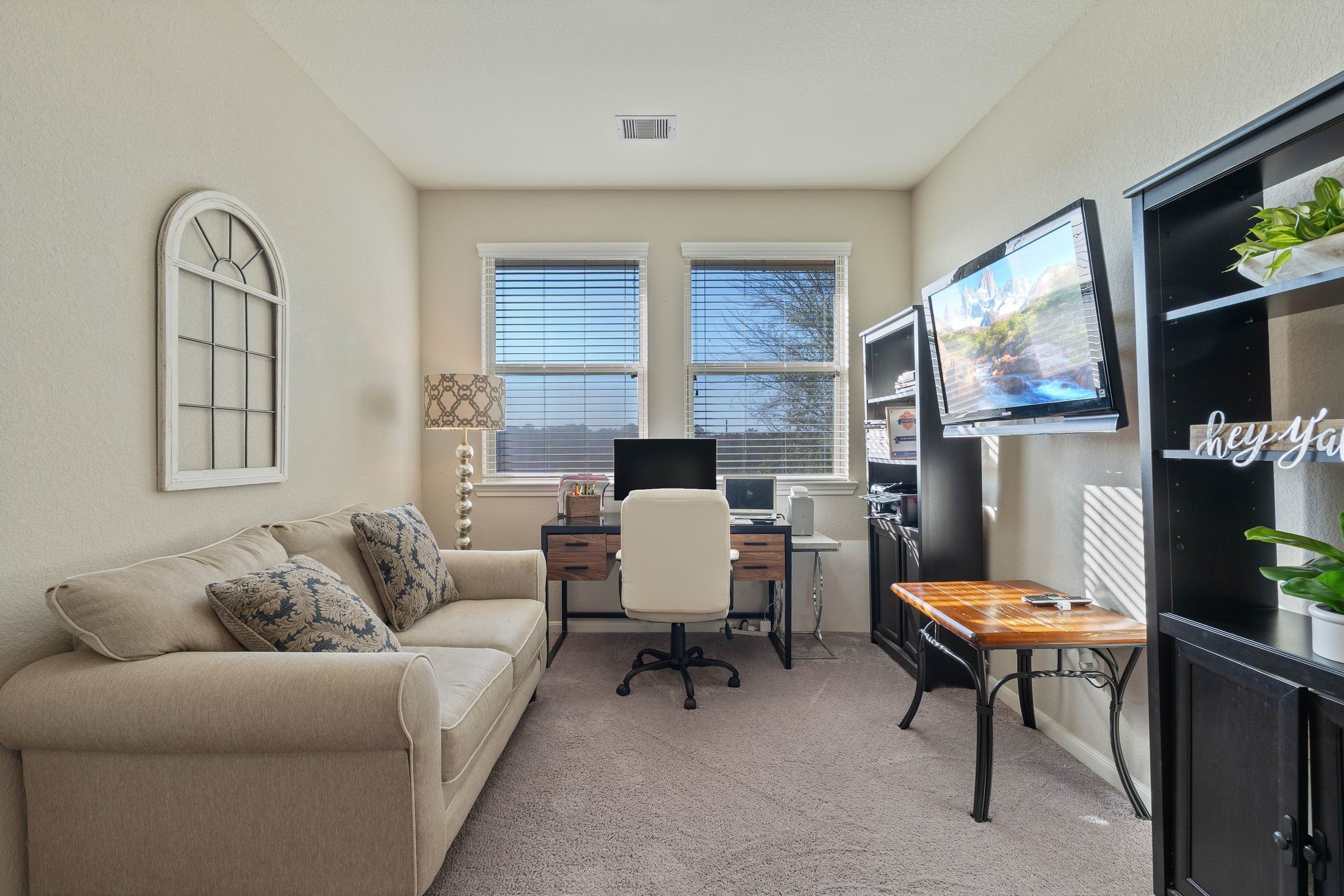 227 Biltmore Loop Montgomery, TX 77316 - Photo 17 of 33 a living room with furniture a flat screen tv and a window