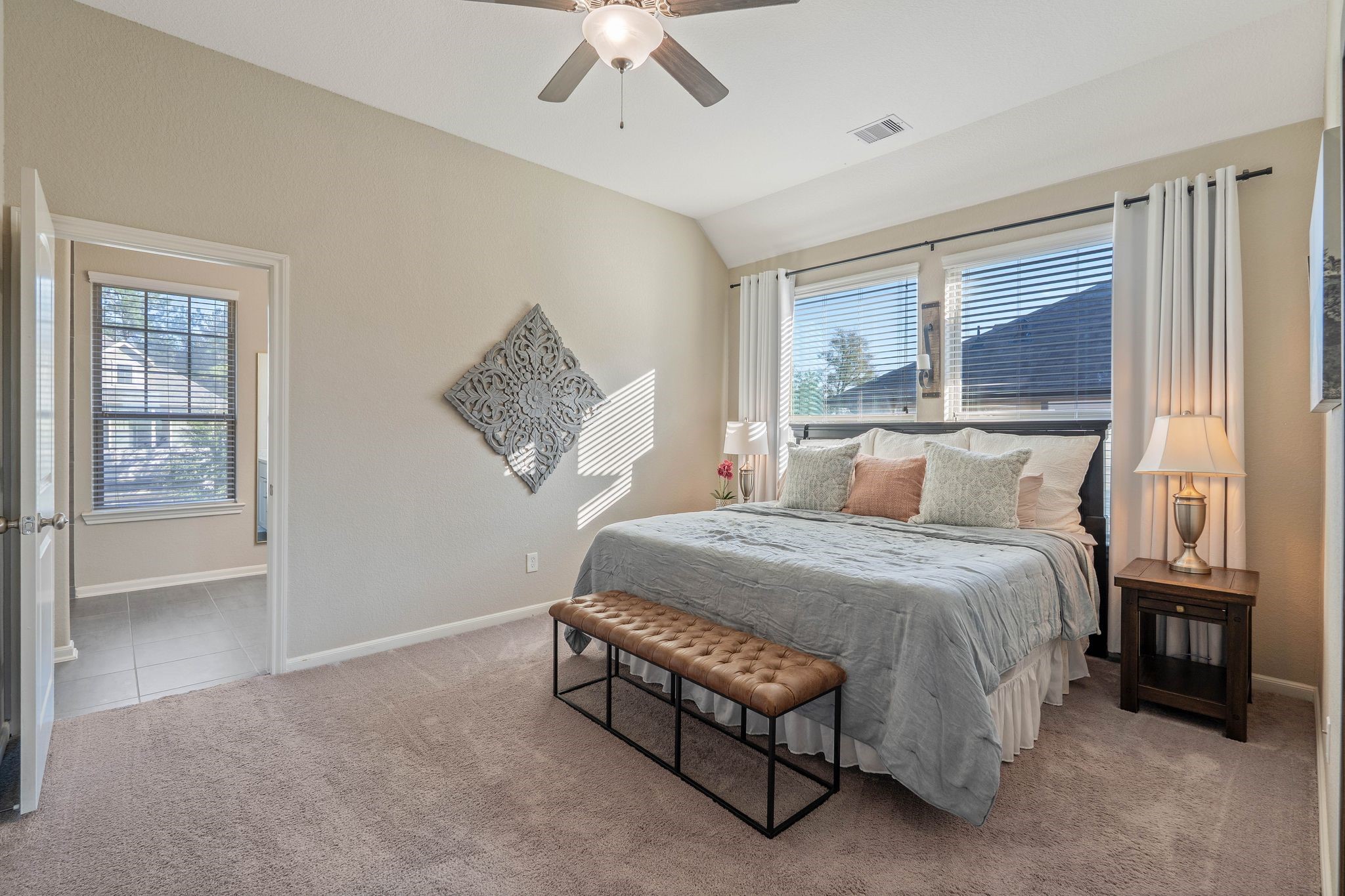 227 Biltmore Loop Montgomery, TX 77316 - Photo 20 of 33 a bedroom with a bed and a window