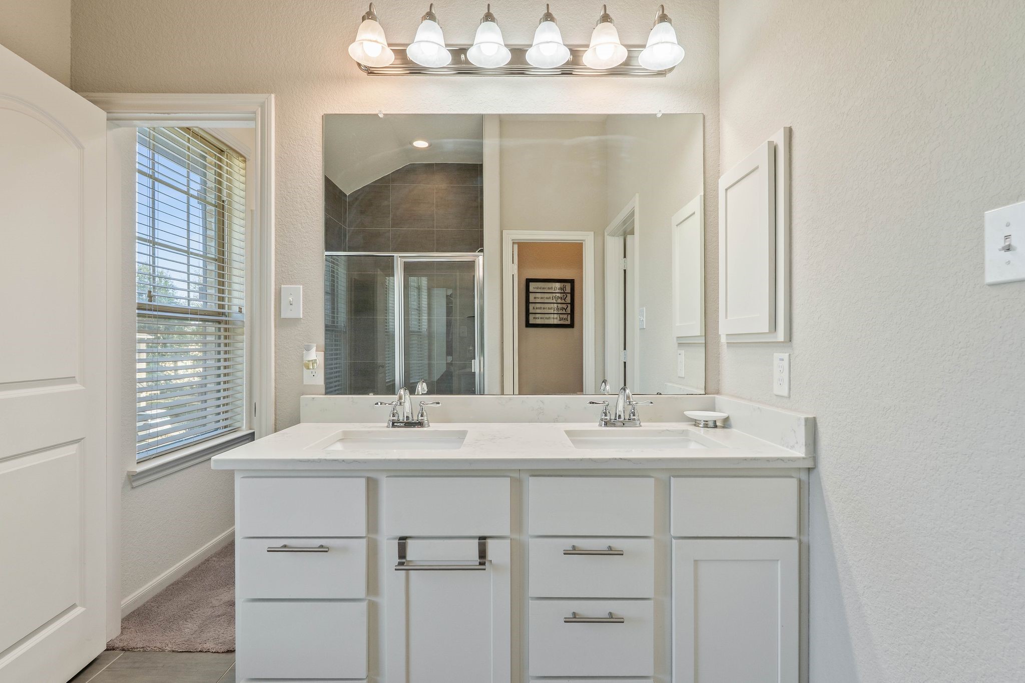 227 Biltmore Loop Montgomery, TX 77316 - Photo 23 of 33 a bathroom with a sink vanity and mirror