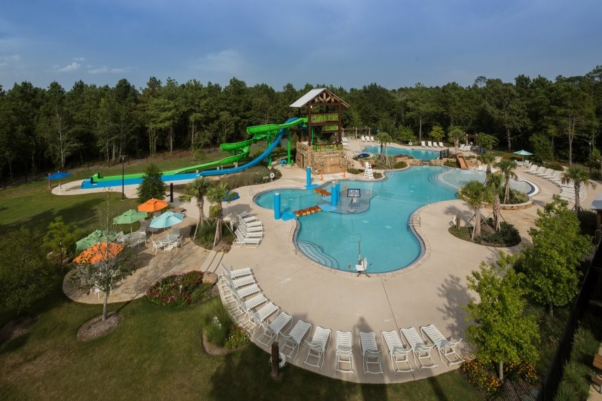 227 Biltmore Loop Montgomery, TX 77316 - Photo 23 of 25 a view of a swimming pool with a yard