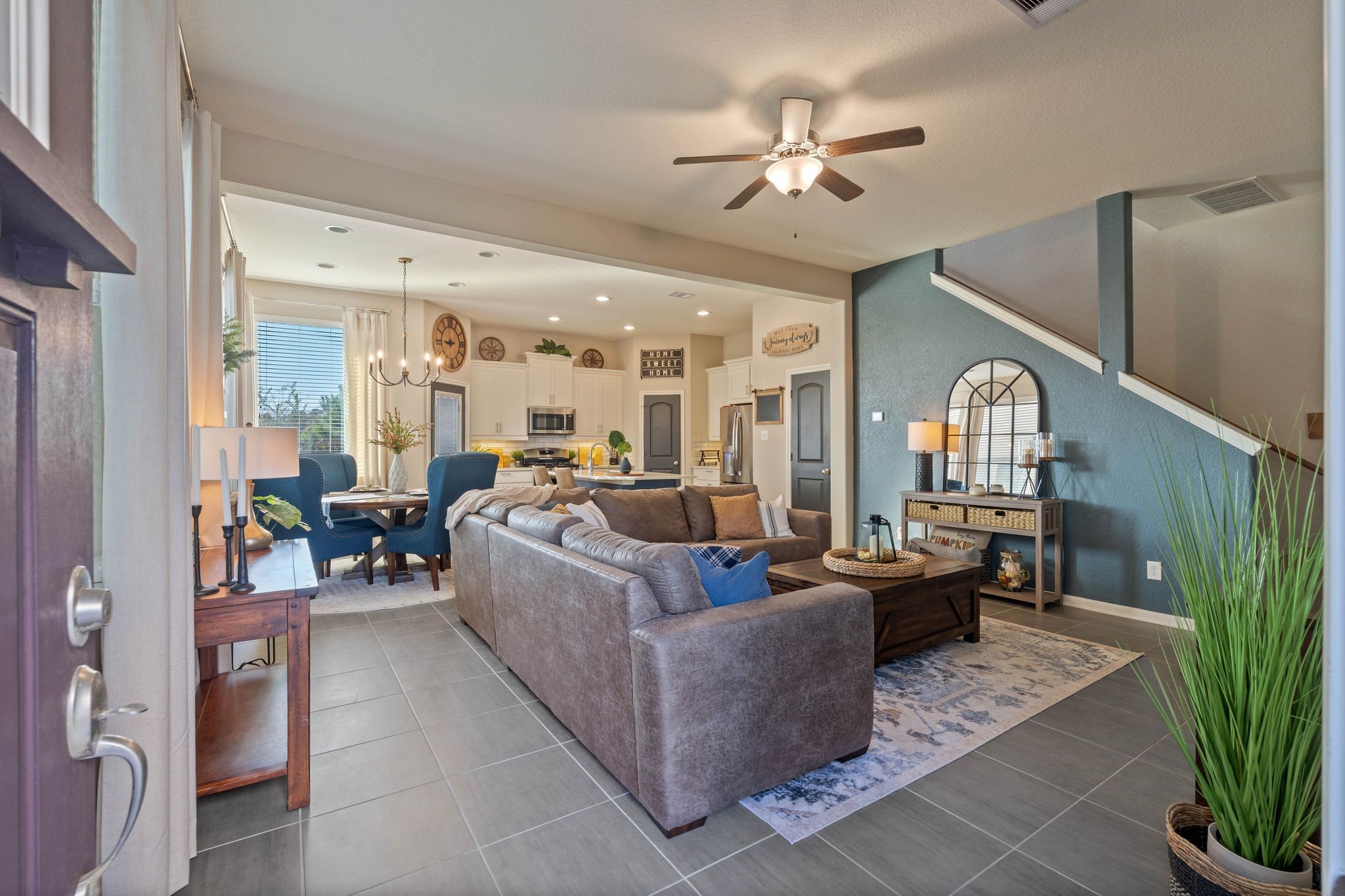 227 Biltmore Loop Montgomery, TX 77316 - Photo 4 of 33 a living room with furniture a chandelier and a window