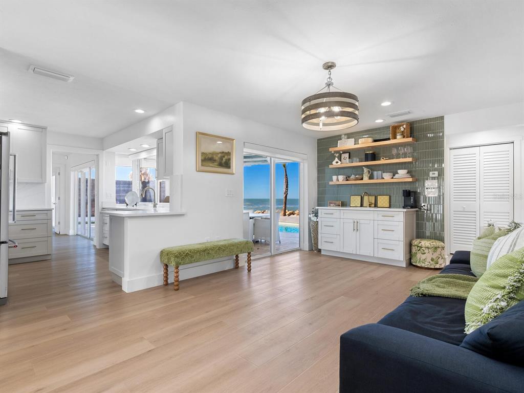 3743 Casey Key Road Nokomis, FL 34275 - Photo 11 of 36 a living room with furniture and kitchen view
