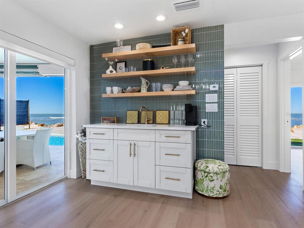 3743 Casey Key Road Nokomis, FL 34275 - Photo 12 of 36 a kitchen with a cabinets and wooden floor