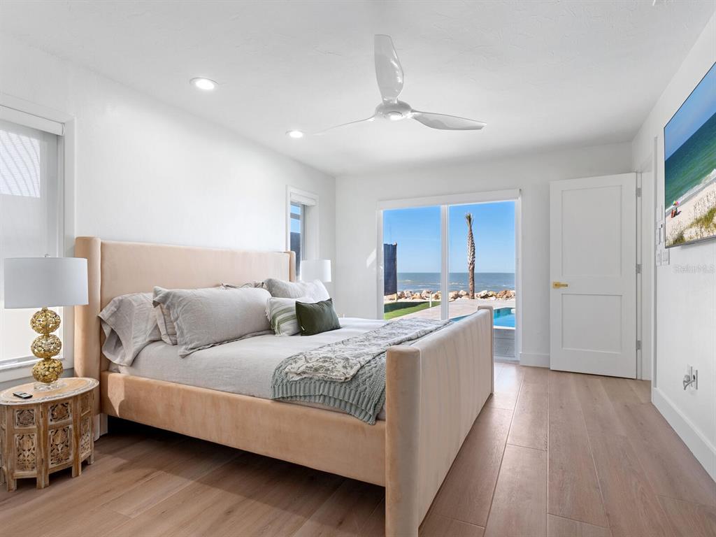 3743 Casey Key Road Nokomis, FL 34275 - Photo 13 of 36 a living room with furniture and a chandelier