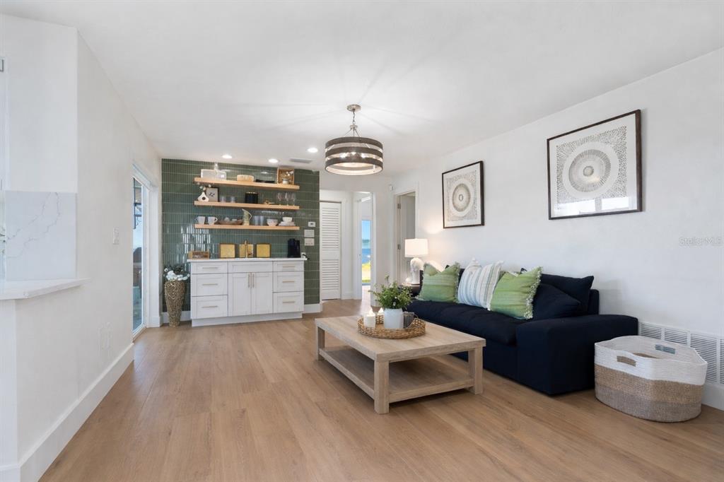 3743 Casey Key Road Nokomis, FL 34275 - Photo 21 of 36 a living room with furniture and a chandelier