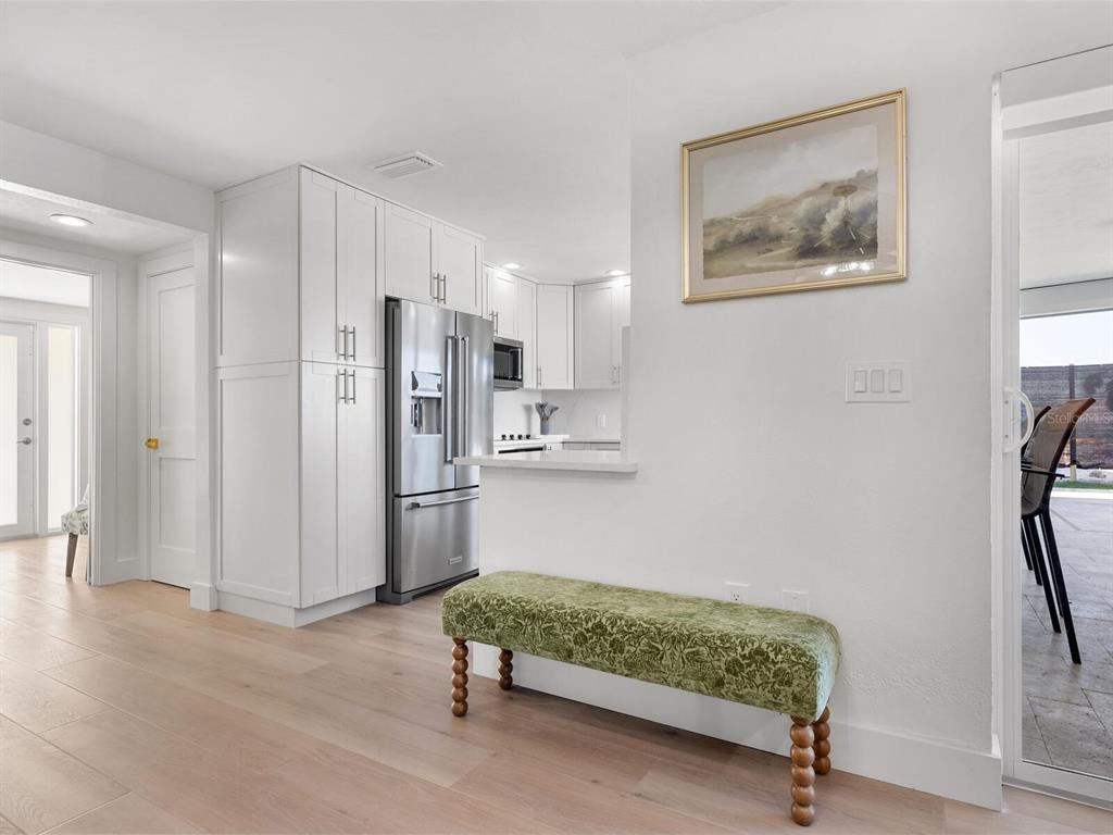 3743 Casey Key Road Nokomis, FL 34275 - Photo 27 of 36 a room with a bed and a couch