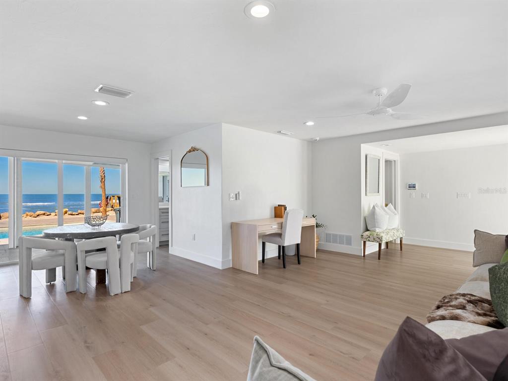 3743 Casey Key Road Nokomis, FL 34275 - Photo 29 of 36 a living room with furniture and wooden floor