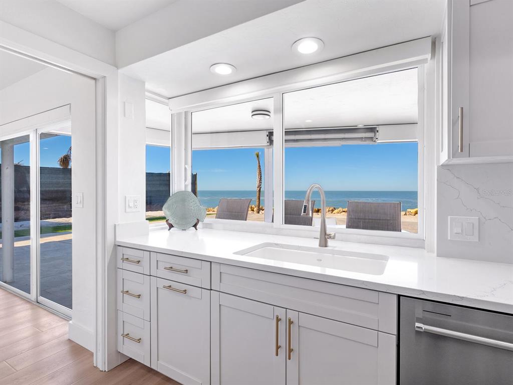 3743 Casey Key Road Nokomis, FL 34275 - Photo 4 of 36 a bathroom with a sink and a mirror