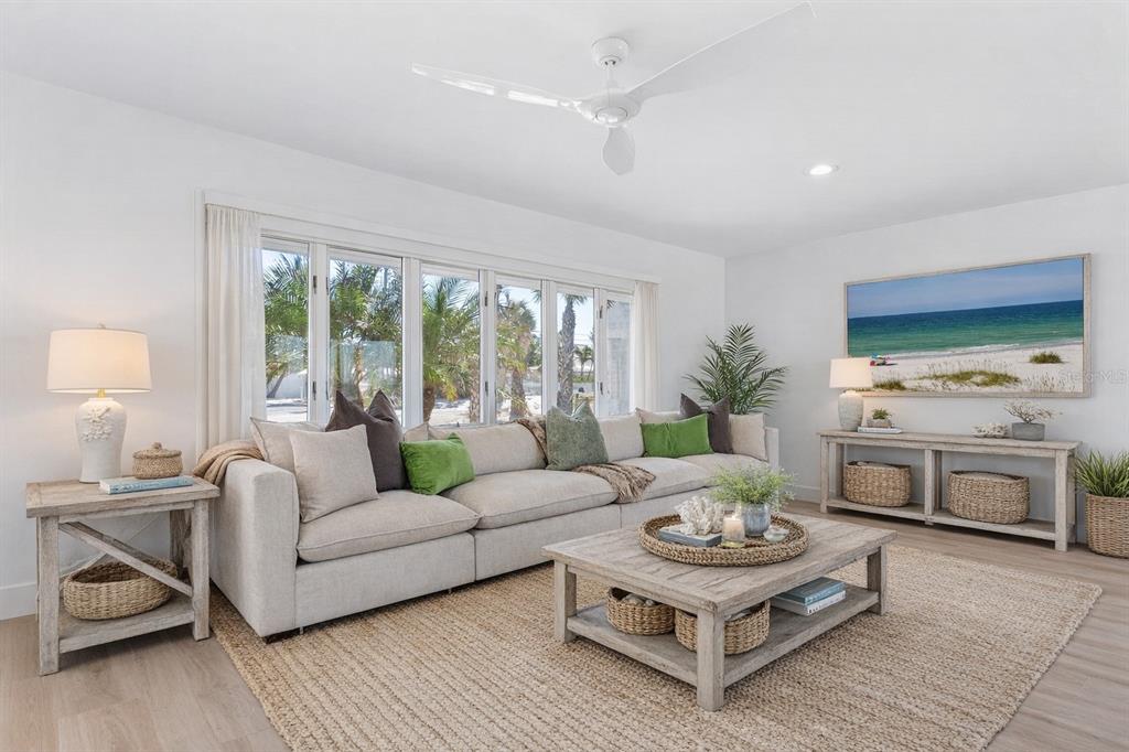 3743 Casey Key Road Nokomis, FL 34275 - Photo 6 of 36 a living room with furniture and a large window