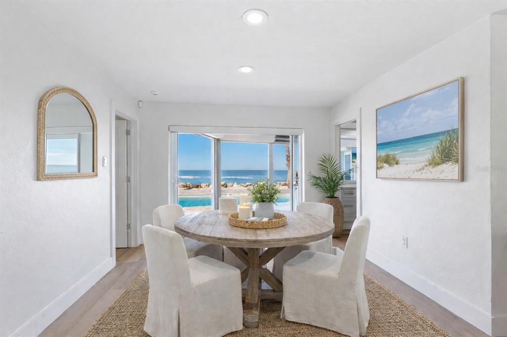 3743 Casey Key Road Nokomis, FL 34275 - Photo 7 of 36 a view of a dining room with furniture and window