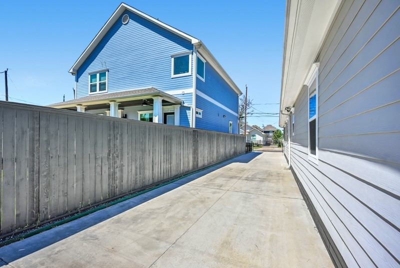 1122 East 23rd Street Houston, TX 77009 - Photo 18 of 23 Gated driveway offering ample off-street parking and additional space for play or outdoor activities.