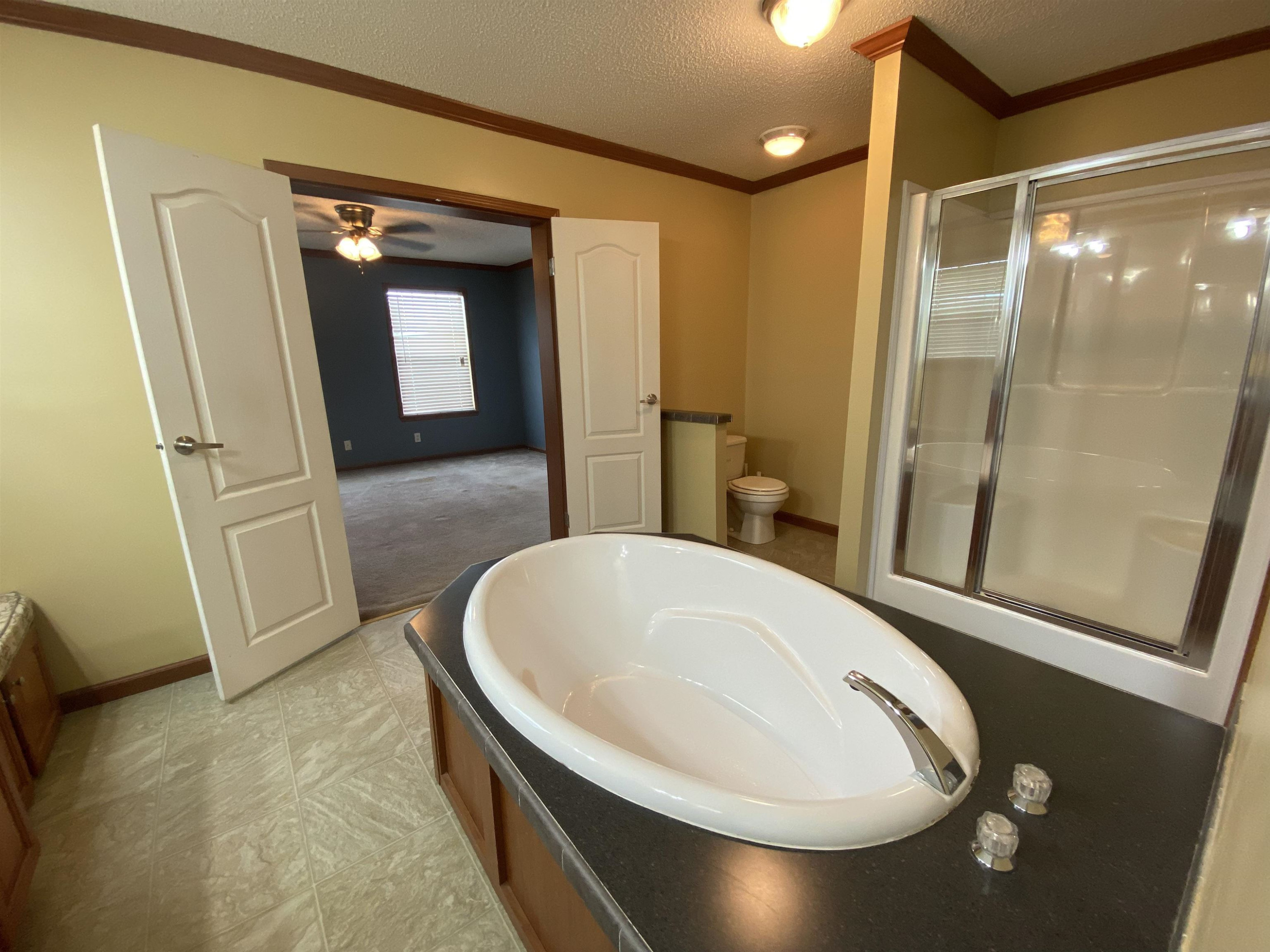 115 Bridgers Road Kenly, NC 27542 - Photo 18 of 30 a bathroom with a tub and shower