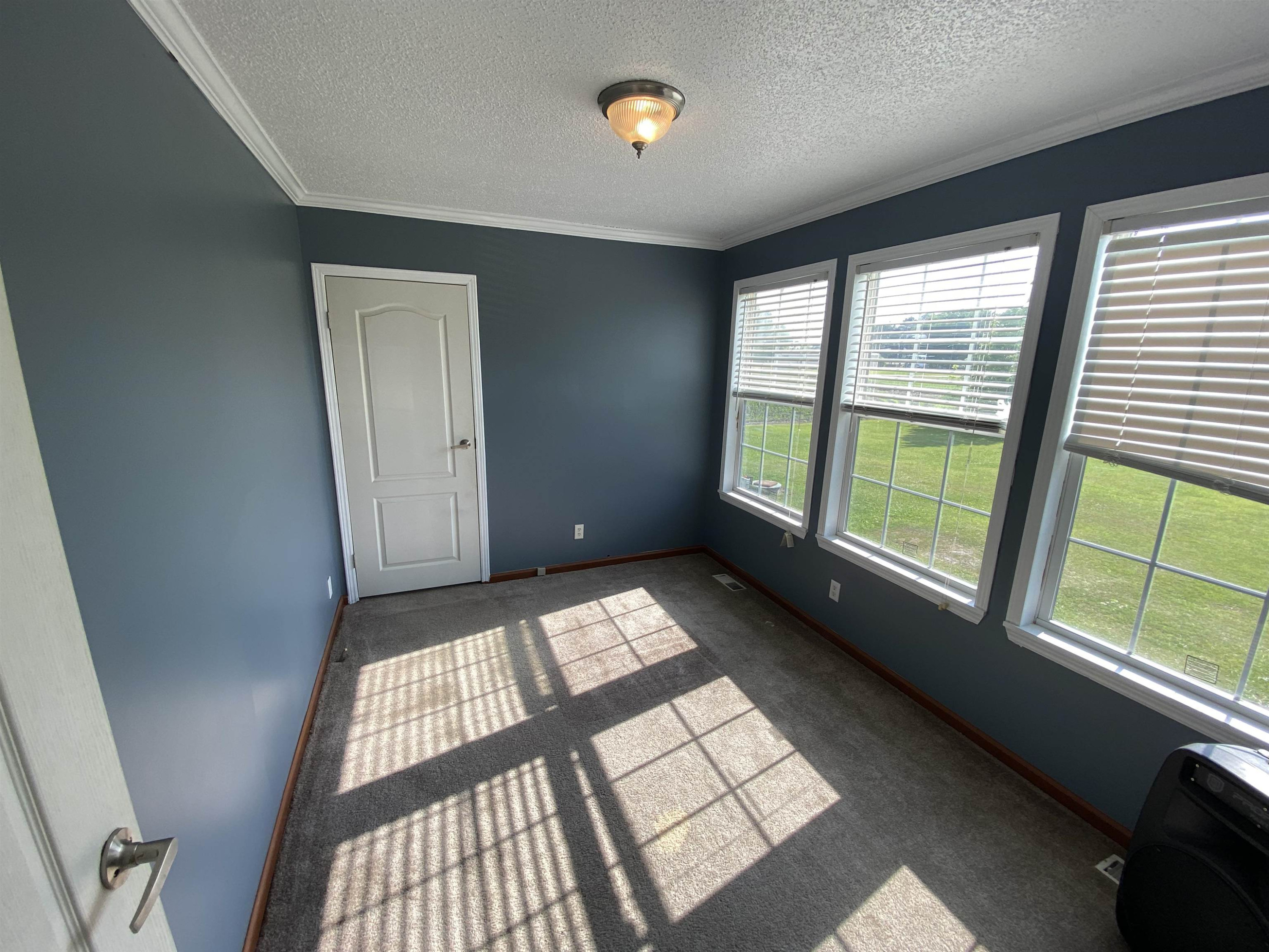 115 Bridgers Road Kenly, NC 27542 - Photo 20 of 30 a view of an empty room and window