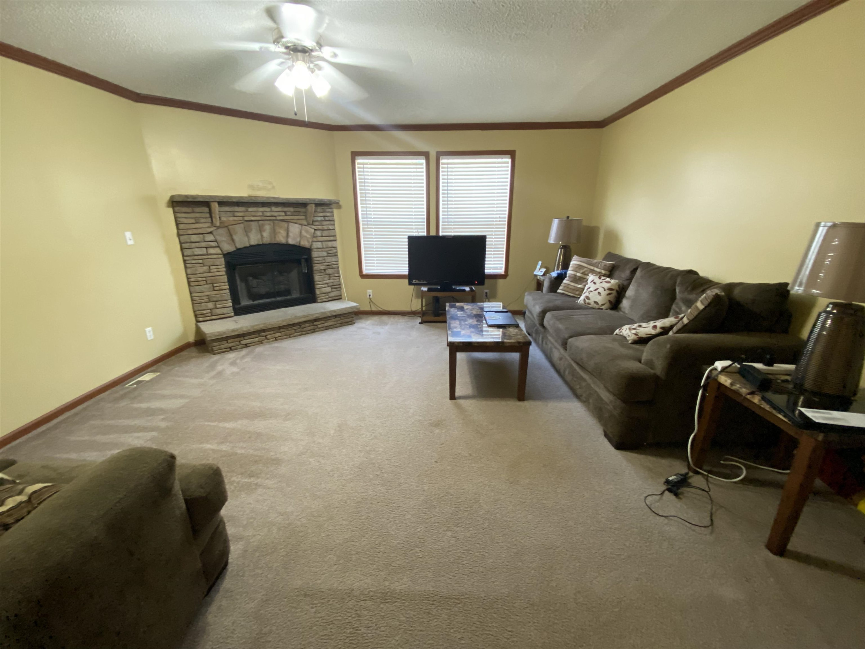 115 Bridgers Road Kenly, NC 27542 - Photo 25 of 30 a living room with furniture and a fireplace