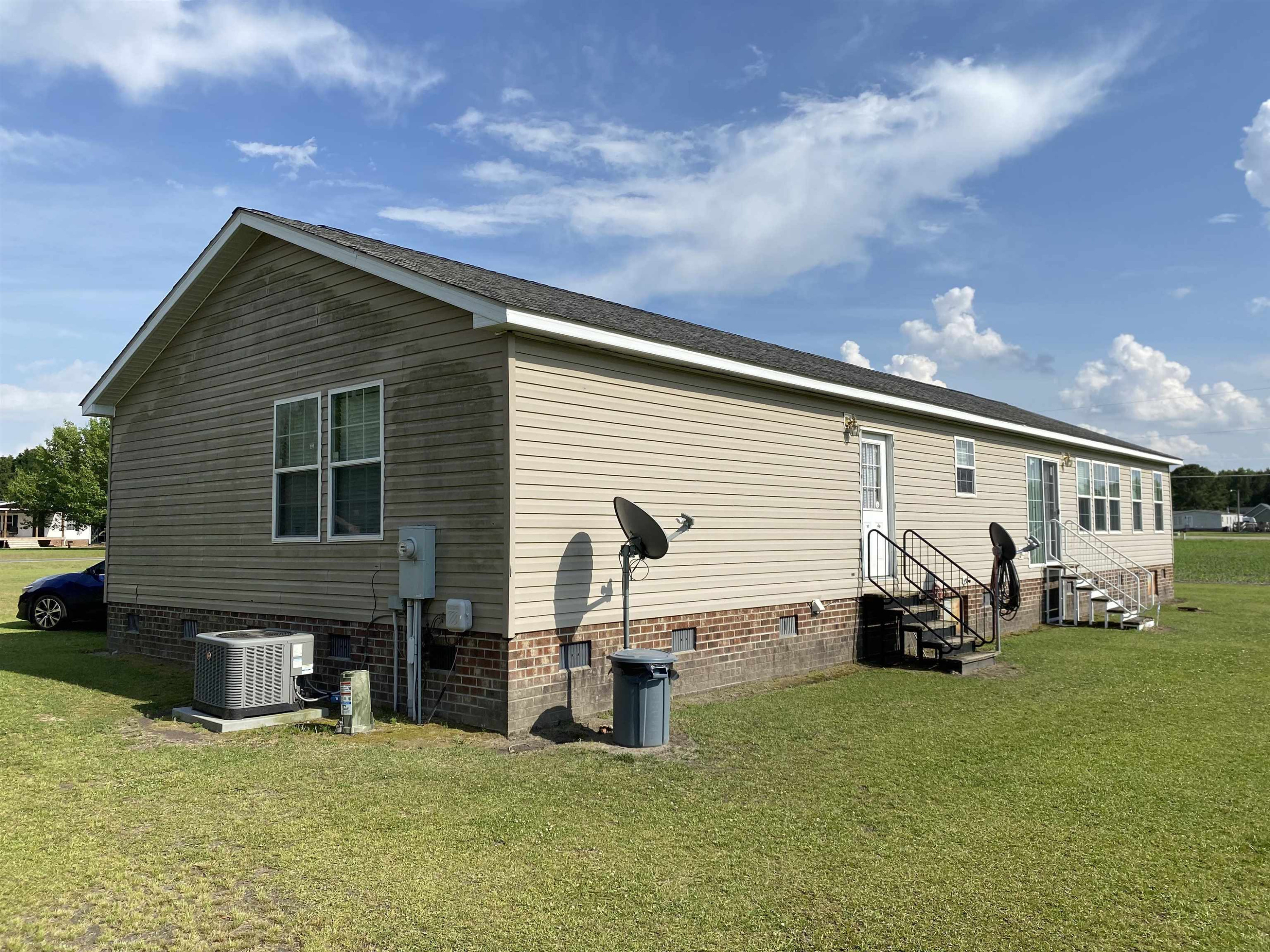 115 Bridgers Road Kenly, NC 27542 - Photo 5 of 30 a front view of a house with patio