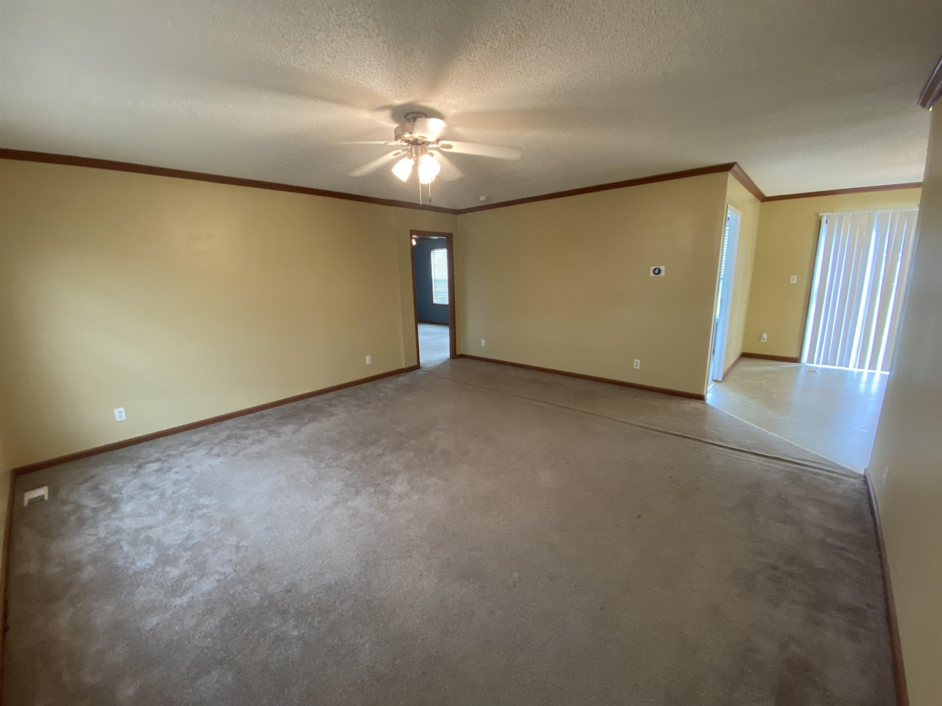 115 Bridgers Road Kenly, NC 27542 - Photo 10 of 30 a view of an empty room with a chandelier fan