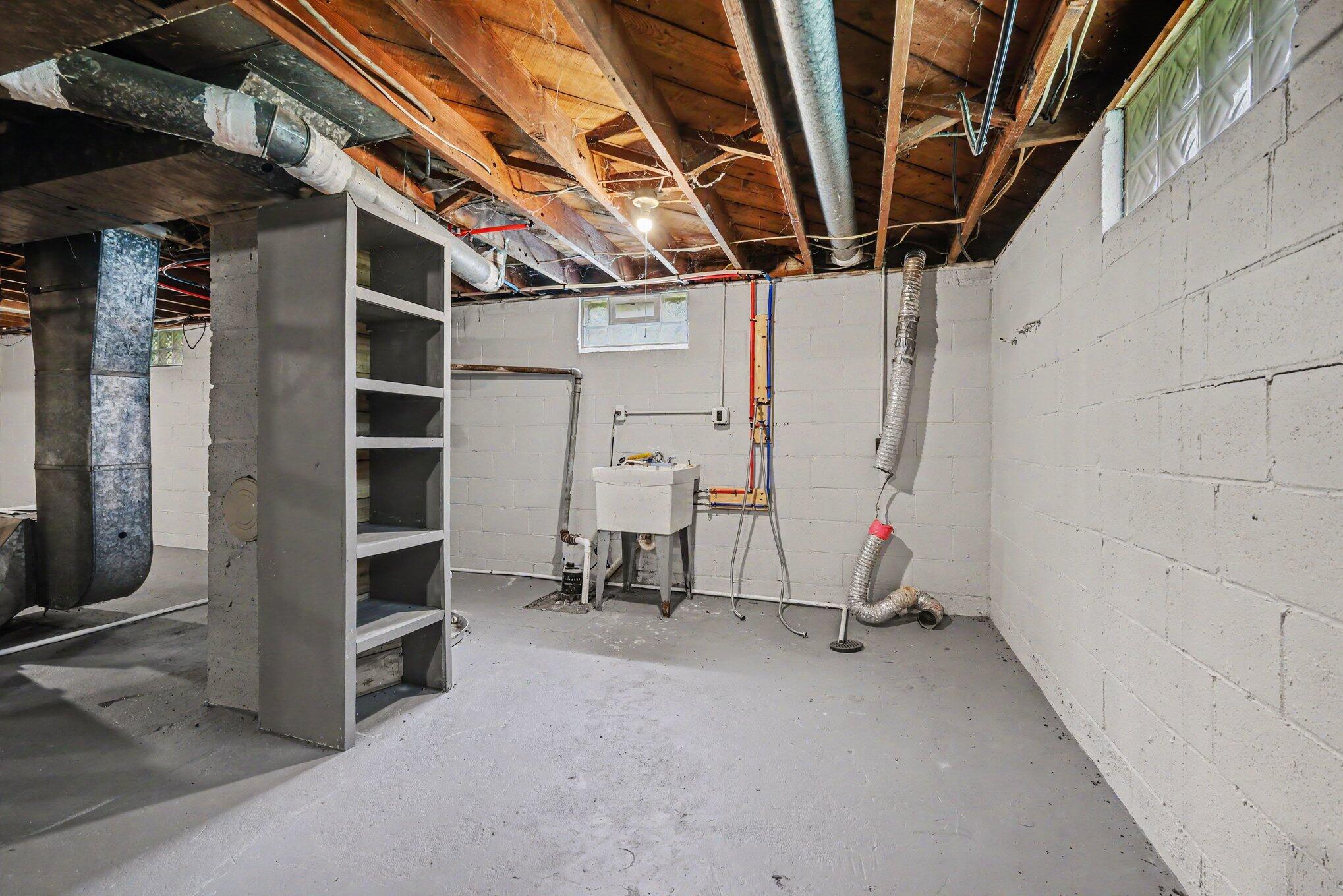 665 4 Mile Road Northwest Comstock Park, MI 49321 - Photo 18 of 35 Basement - Laundry hookup