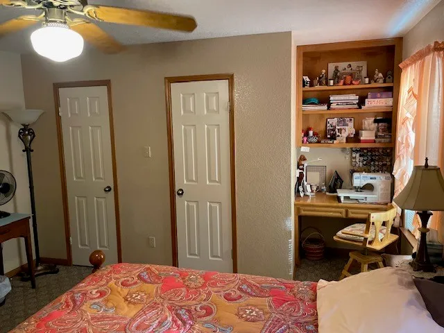 a bedroom with a bed and closet