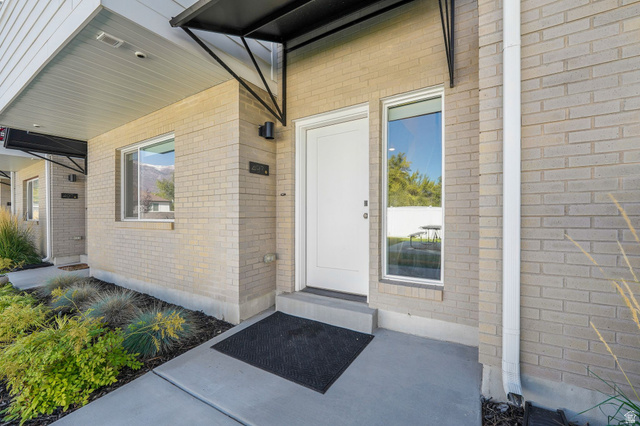 493 East Alice Way Layton, UT 84041 - Photo 23 of 31 View of exterior entry featuring brick siding