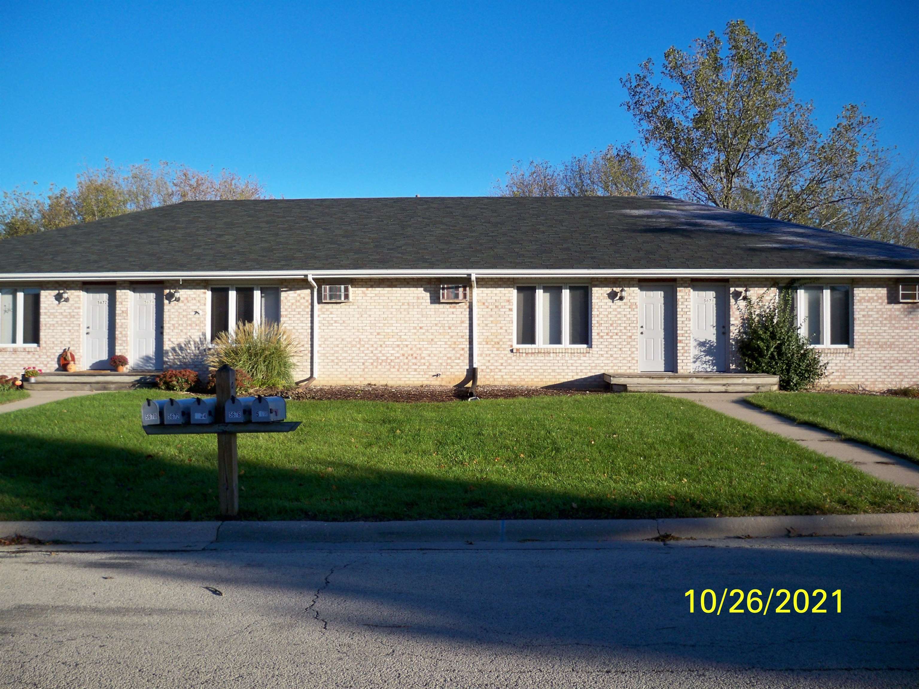 5672-8 Covey Ridge Trail Loves Park, IL 61111 - Photo 1 of 4 front view of a house with a yard