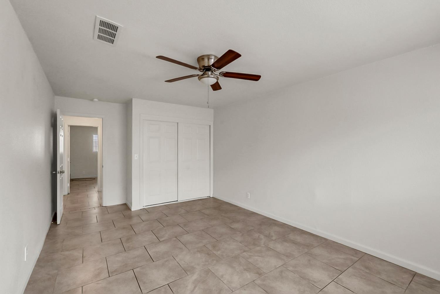 72 East 12th Street Merced, CA 95341 - Photo 6 of 13 a view of a big room with carpet