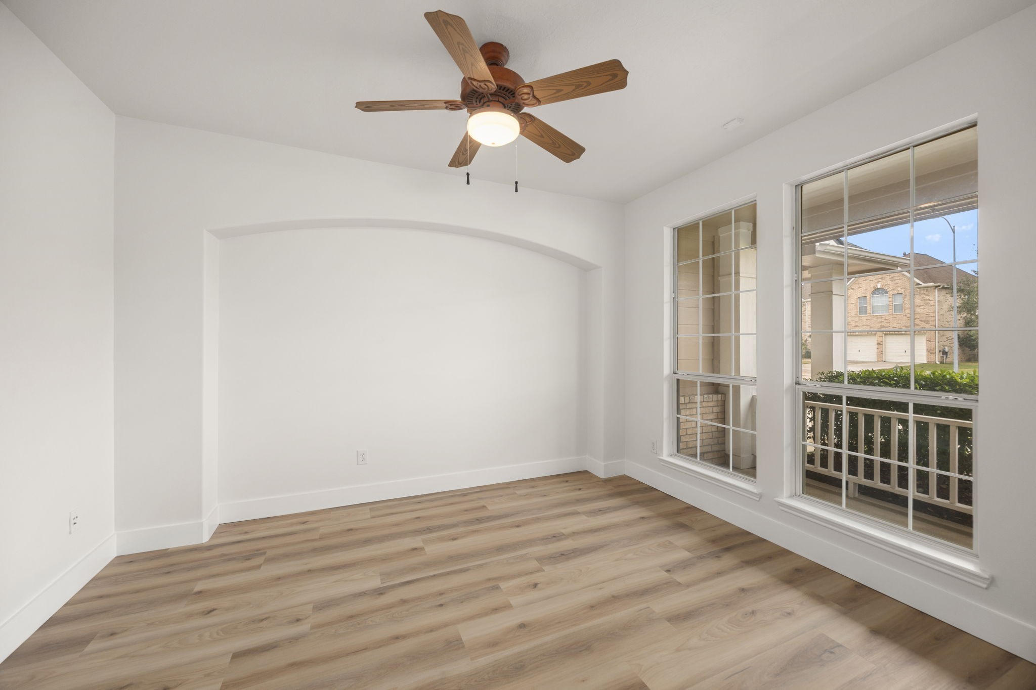 20923 Bayeux Lane Spring, TX 77388 - Photo 20 of 50 an empty room with wooden floor and windows
