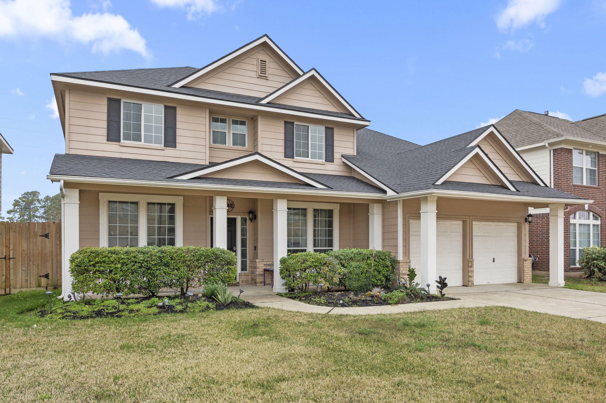 20923 Bayeux Lane Spring, TX 77388 - Photo 3 of 50 a front view of a house with a garden