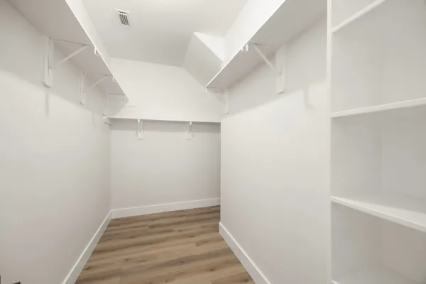 a view of an empty walk in closet