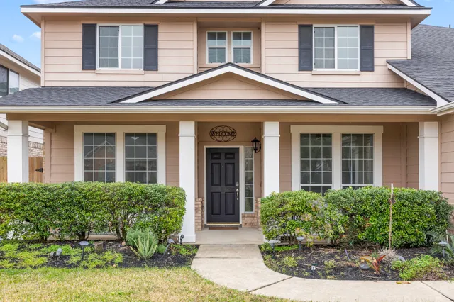 a kitchen with stainless steel appliances granite countertop a stove a sink dishwasher and a refrigerator