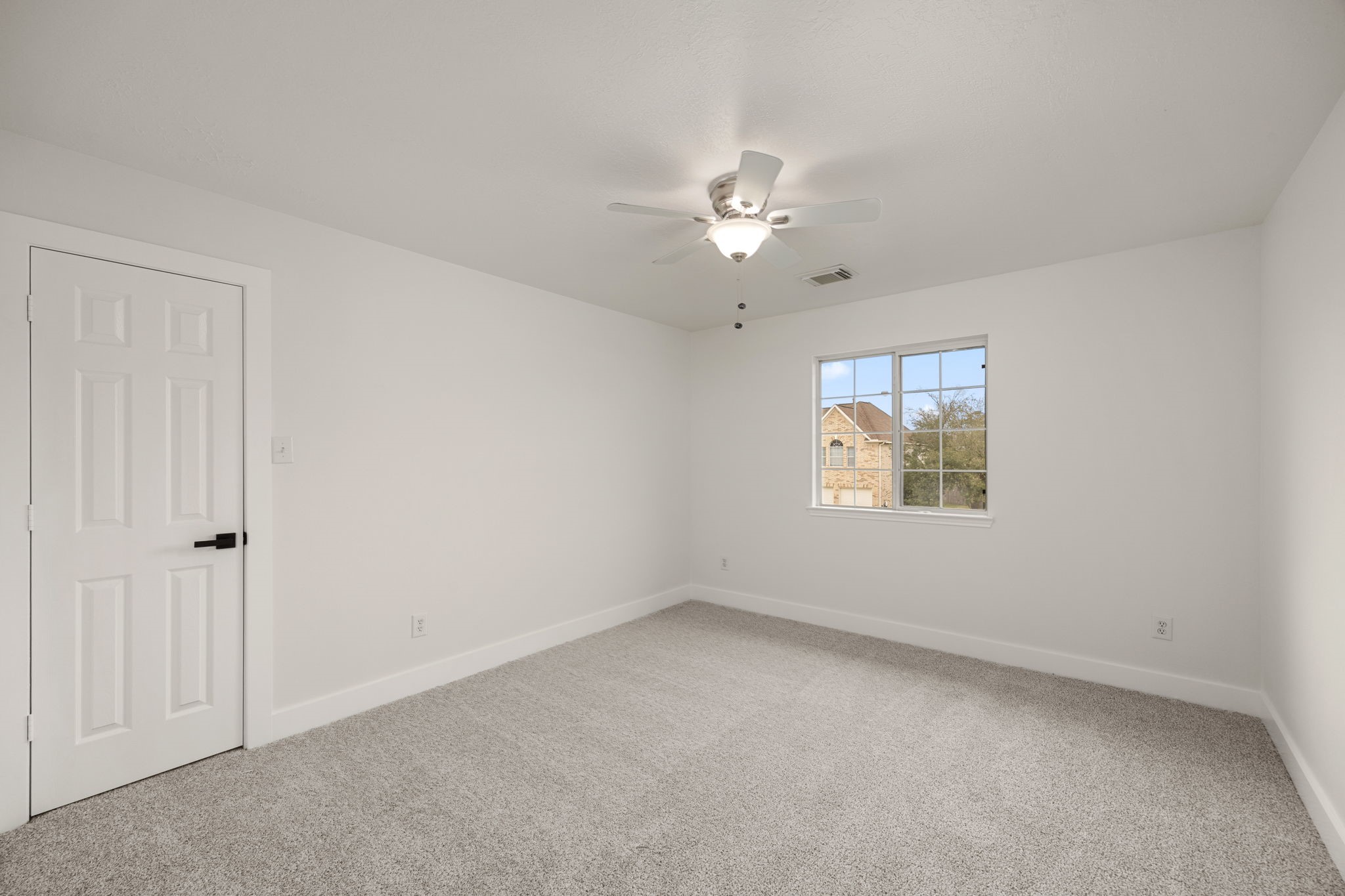 20923 Bayeux Lane Spring, TX 77388 - Photo 44 of 50 an empty room with a window and a fan