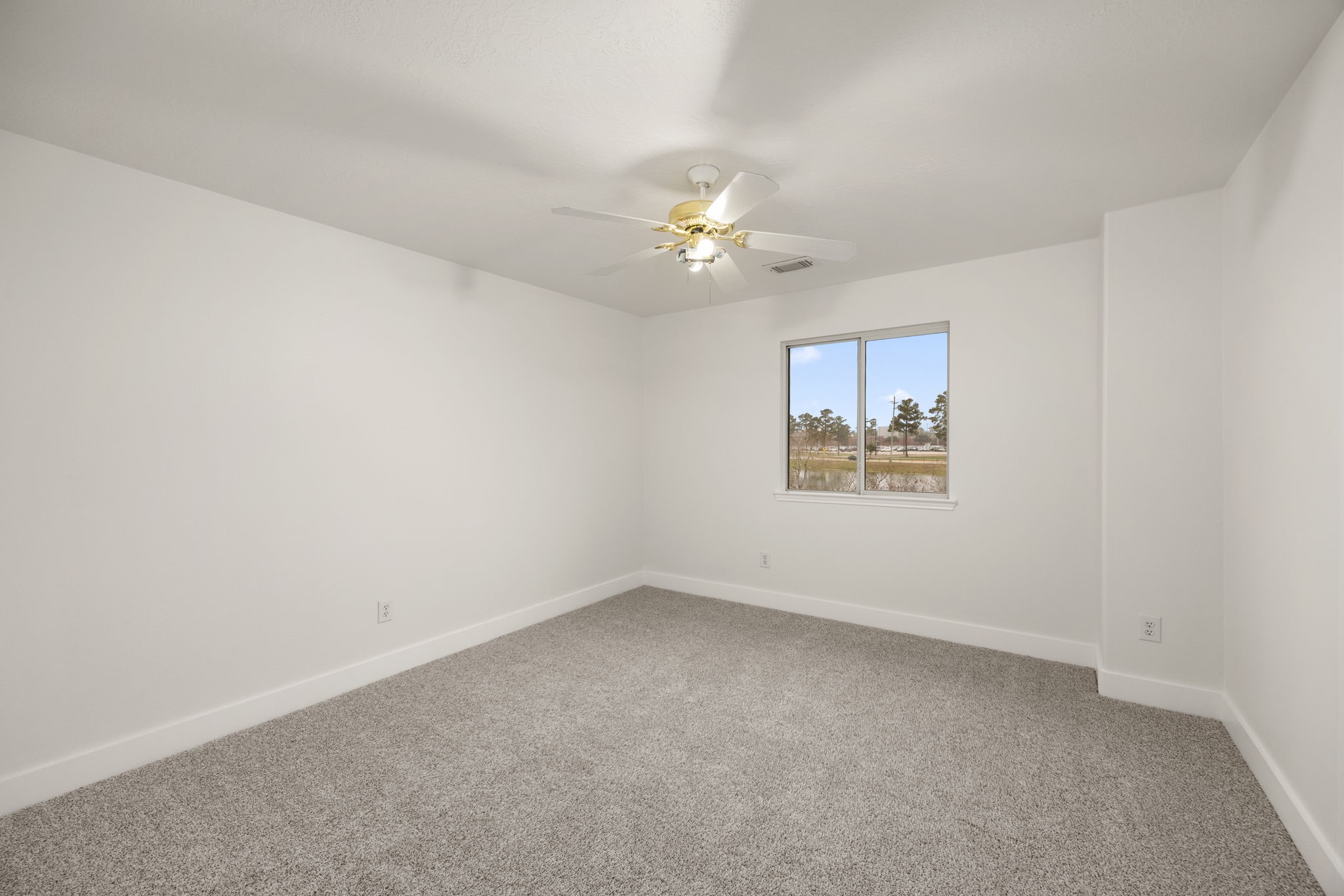 20923 Bayeux Lane Spring, TX 77388 - Photo 46 of 50 an empty room with a window and a ceiling fan