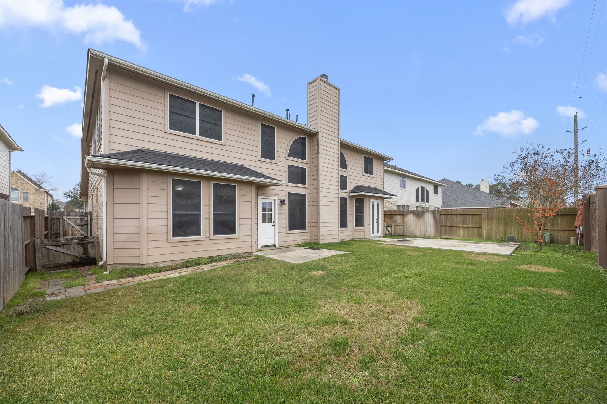 20923 Bayeux Lane Spring, TX 77388 - Photo 48 of 50 a front view of a house with a garden