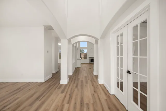 a living room with furniture a rug and a large window
