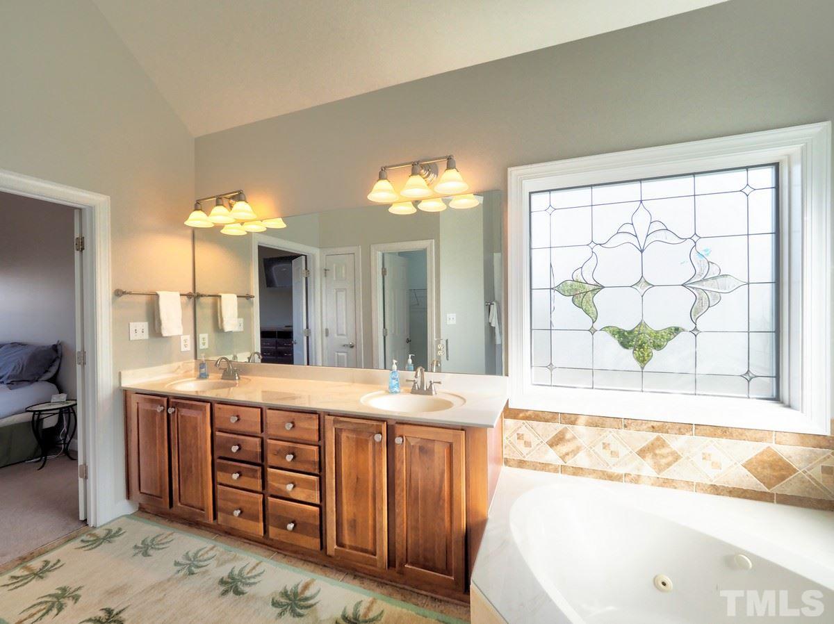 4501 Fairview Ridge Lane Apex, NC 27539 - Photo 17 of 30 Dual sinks, corner soaking tub, tiled floors/surrounds, separate water closet, large WI closet for 'her'