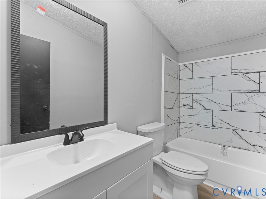 1909 Neves Road Beaverdam, VA 23015 - Photo 32 of 48 Modern bathroom featuring a framed mirror with int