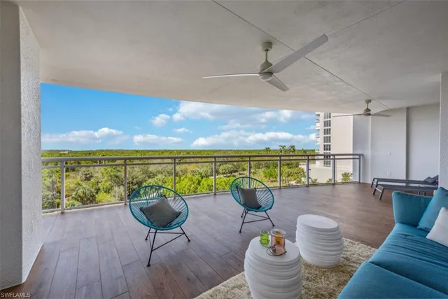 a view of a living room and a wooden floor