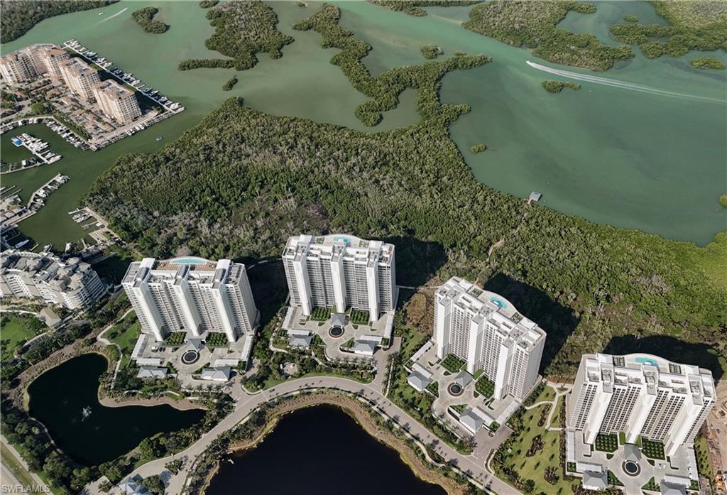 13915 Old Coast Road, Unit 504 Naples, FL 34110 - Photo 20 of 41 an aerial view of a house with outdoor seating