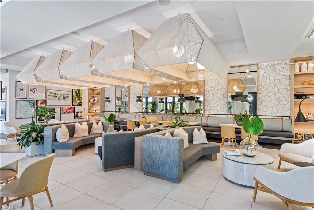 13915 Old Coast Road, Unit 504 Naples, FL 34110 - Photo 31 of 41 a living room with lots of furniture and a large window