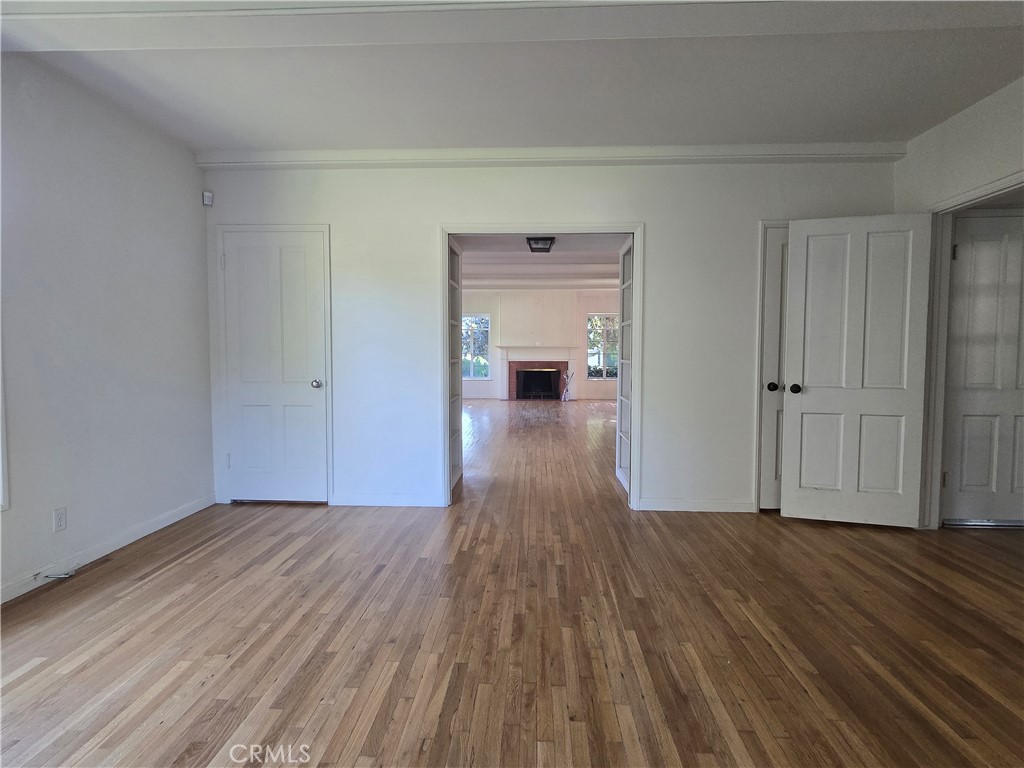 1868 St Albans Road San Marino, CA 91108 - Photo 12 of 15 wooden floor in a hall with an empty room