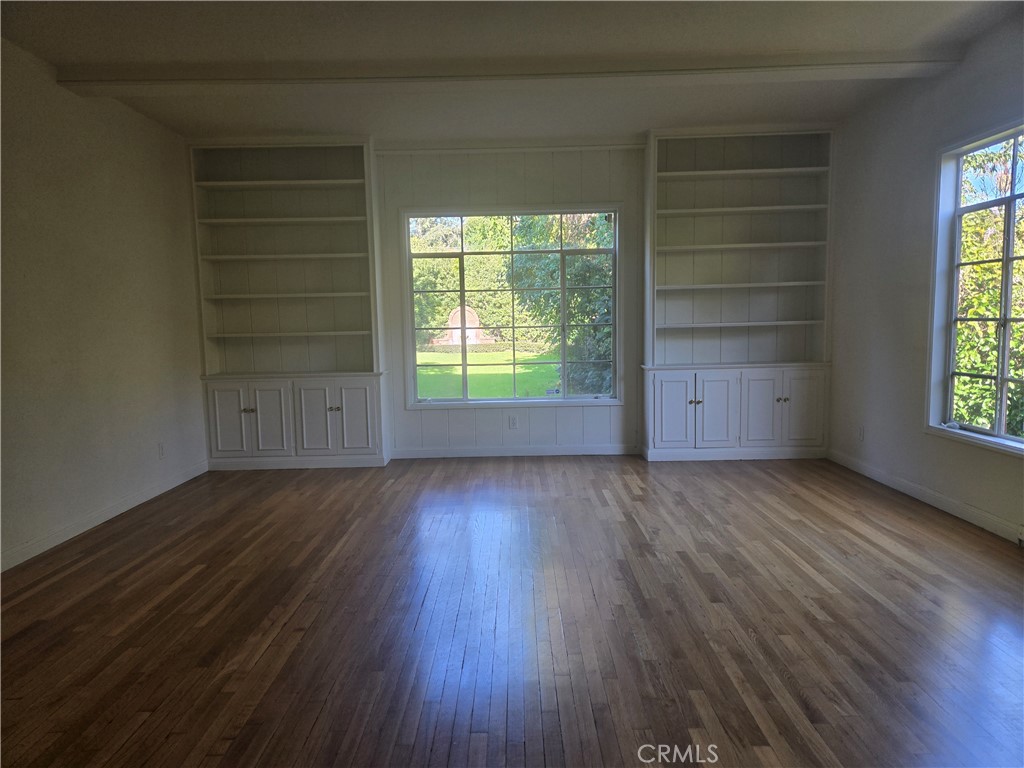 1868 St Albans Road San Marino, CA 91108 - Photo 6 of 15 an empty room with wooden floor and windows