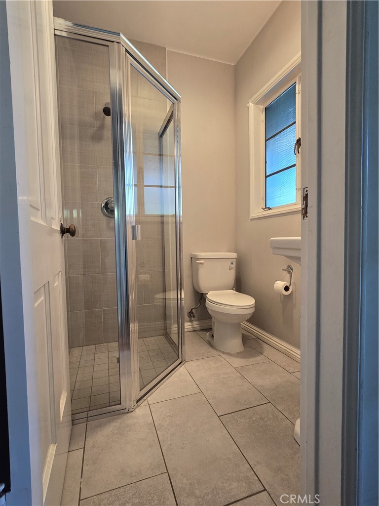 1868 St Albans Road San Marino, CA 91108 - Photo 7 of 15 a bathroom with a toilet and a shower