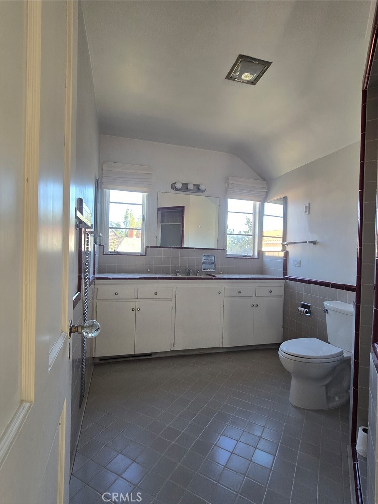 1868 St Albans Road San Marino, CA 91108 - Photo 10 of 15 a bathroom with a granite countertop sink mirror and toilet