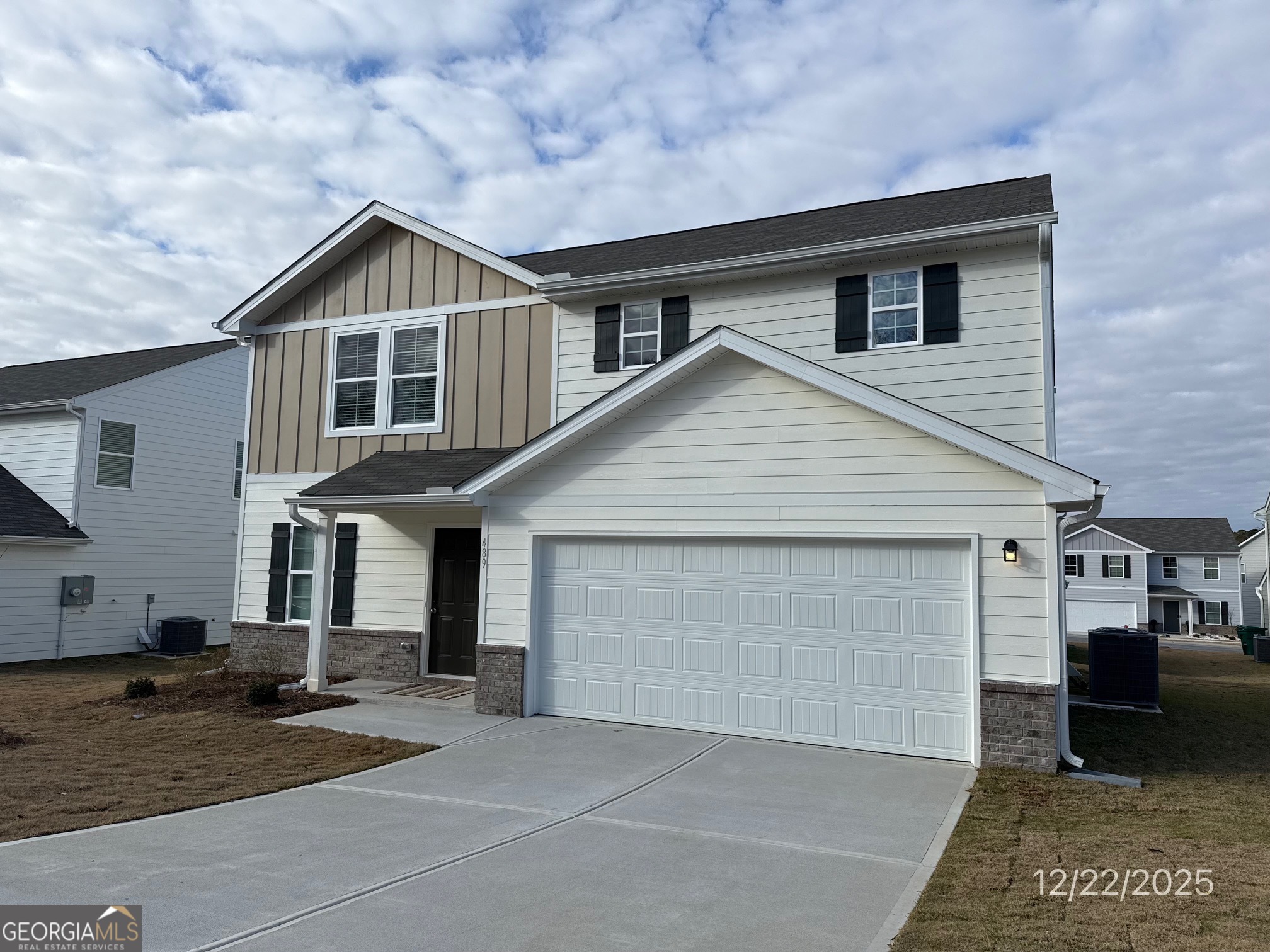 489 Grand Magnolia Street Jackson, GA 30233 - Photo 1 of 19 a view of a house with a yard