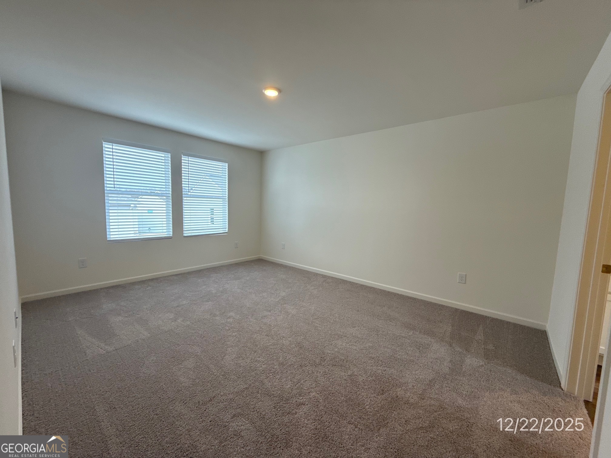 489 Grand Magnolia Street Jackson, GA 30233 - Photo 13 of 19 an empty room with windows