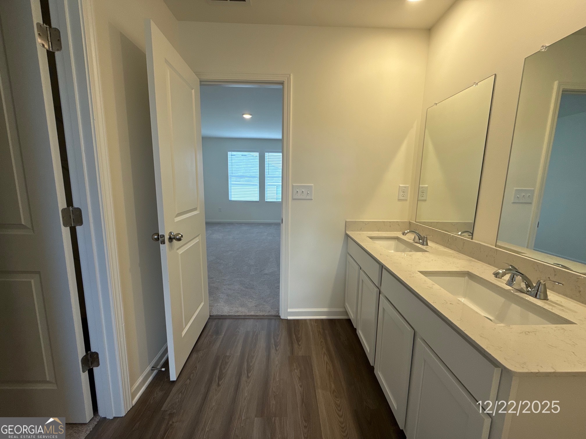489 Grand Magnolia Street Jackson, GA 30233 - Photo 16 of 19 a bathroom with a granite countertop sink a mirror and a shower