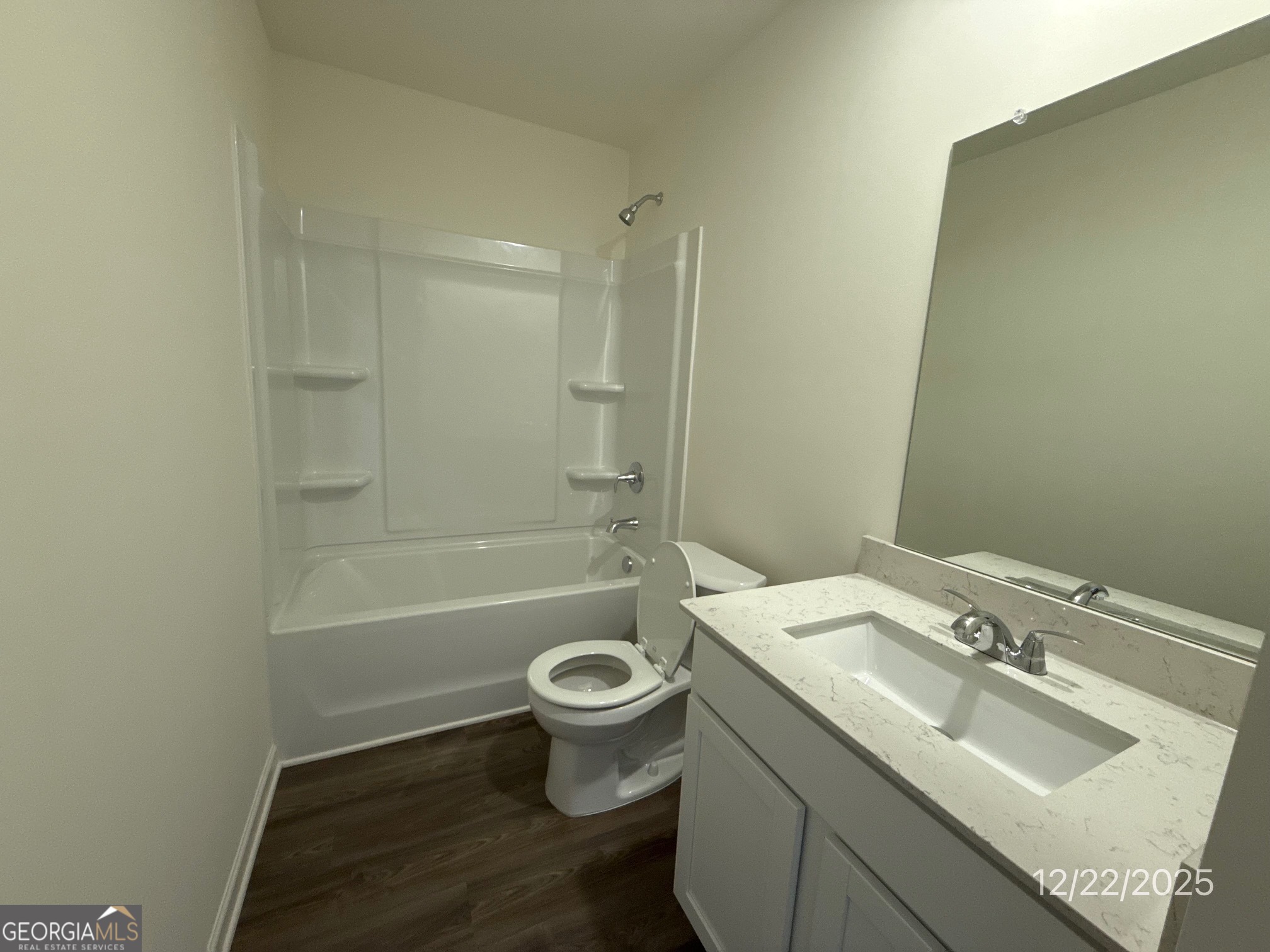 489 Grand Magnolia Street Jackson, GA 30233 - Photo 18 of 19 a bathroom with a sink toilet and shower