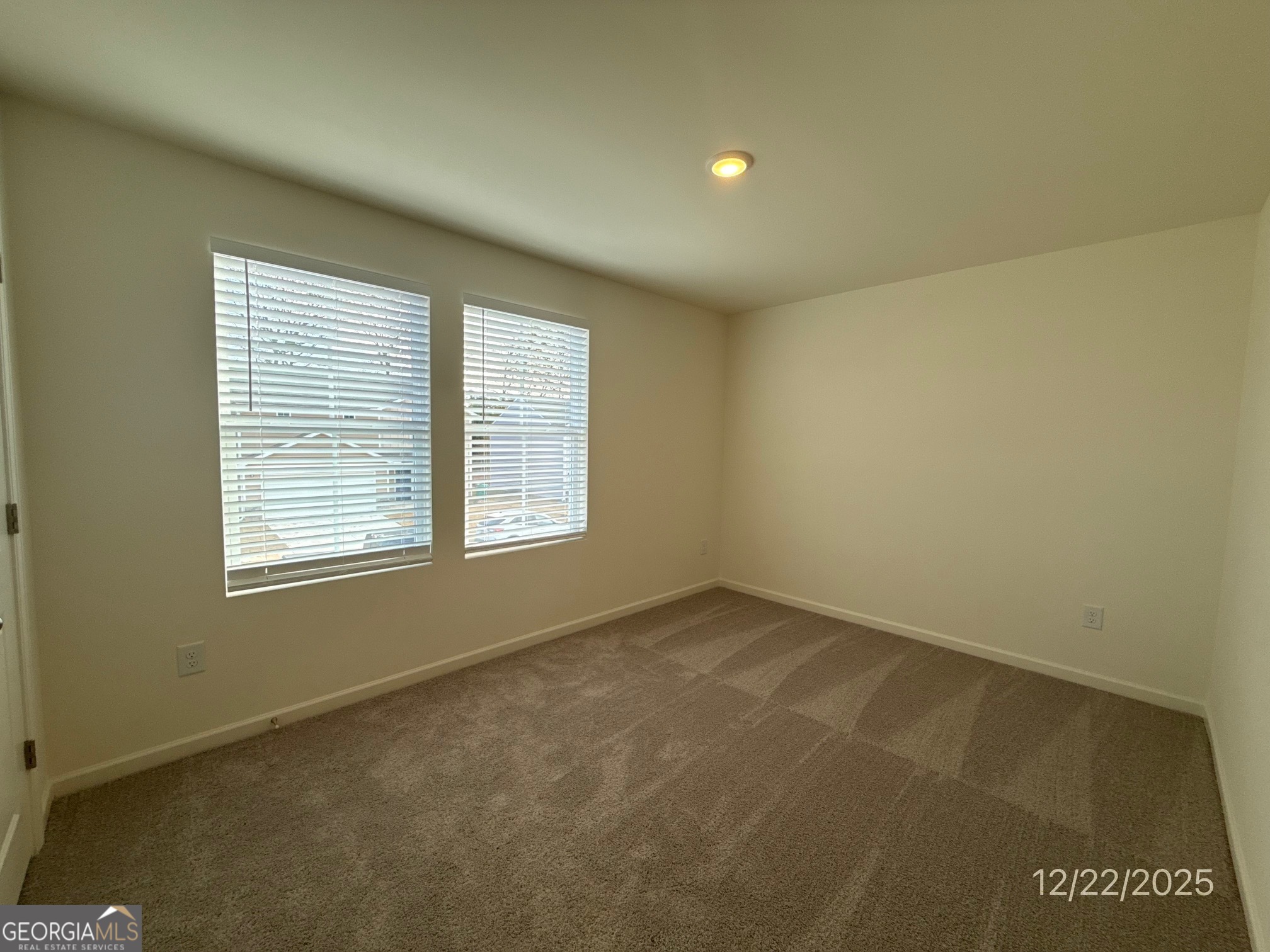489 Grand Magnolia Street Jackson, GA 30233 - Photo 19 of 19 an empty room with a window