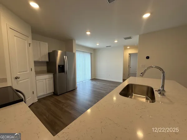 a view of a livingroom with wooden floor